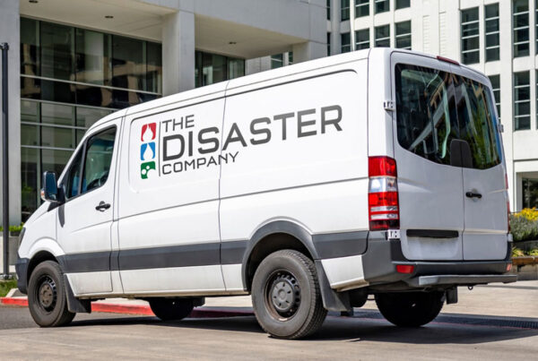 The Disaster Company Van in front of a business
