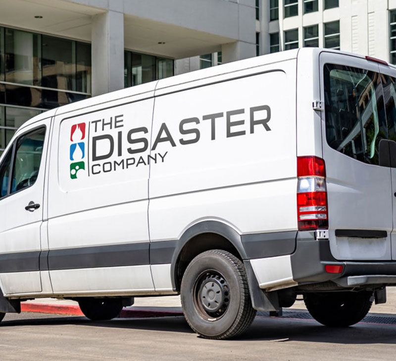 The Disaster Company Van in front of a business